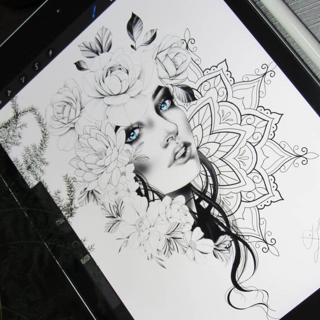 woman's face in black and white with crystal blue eyes, surrounded by flowers